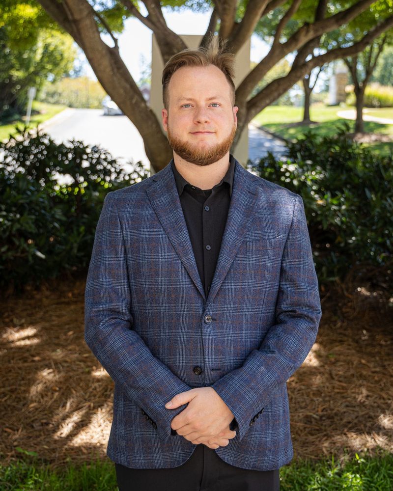 Casey McClintic standing outside an office in Atlanta
